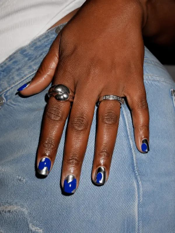Cobalt and silver nail art on short natural nails